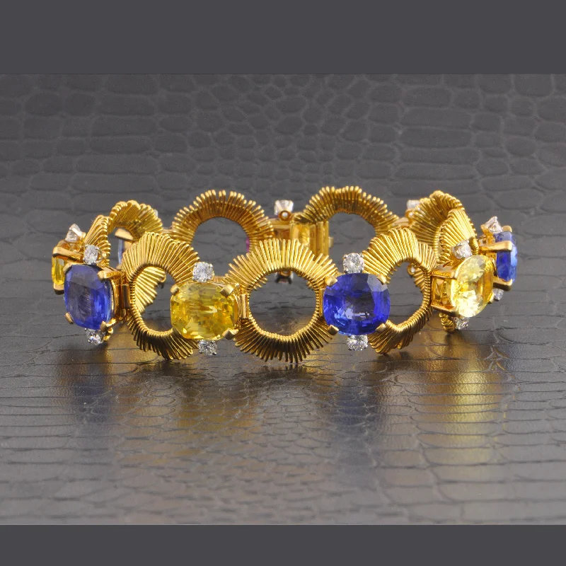 Shine Without Limits – Jewelry Sale Happening Now Vintage Gubelin 1960s Multicolored Sapphire and Diamond Bracelet in 18k Yellow Gold and Palladium